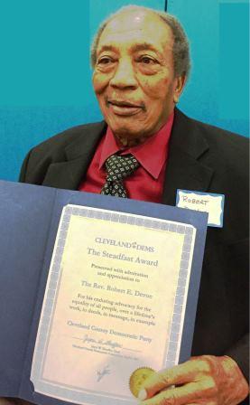 Rev. Dr. Robert E. Devoe holding award